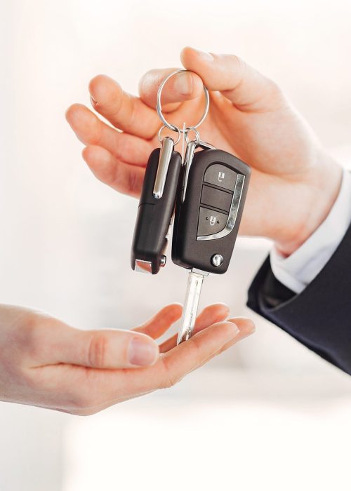 Woman buying the car. Lady in a car salon. Manager with a client